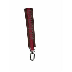 NWOT LULULEMON NEVER LOST KEYCHAIN WORDMARK PINK AND BROWN COLOR ONE SIZE